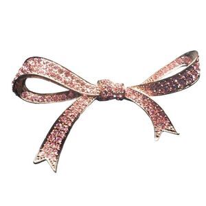 Vintage Kenneth Jay Lane rose gold colored bow brooch